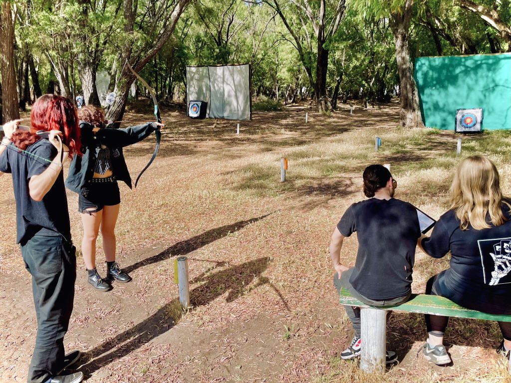 A group of people doing archery in our outdoor range in Busselton
