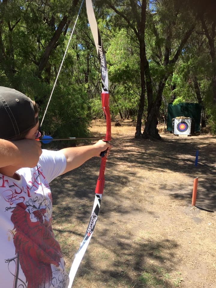 Visitor enjoying outdoor archery at Primal Archery in Busselton