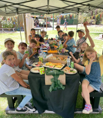 Birthday group celebrating with outdoor archery and mini golf.