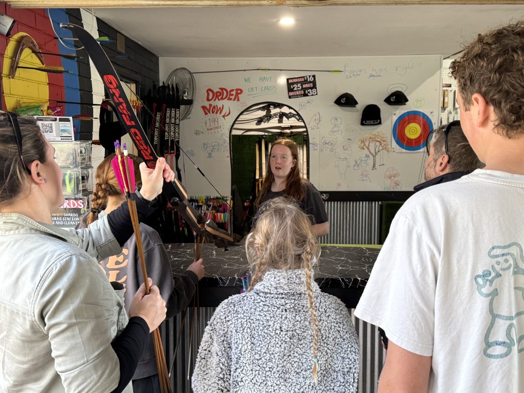 Alexis welcoming visitors and delivering the safety briefing at Primal Archery in Busselton.