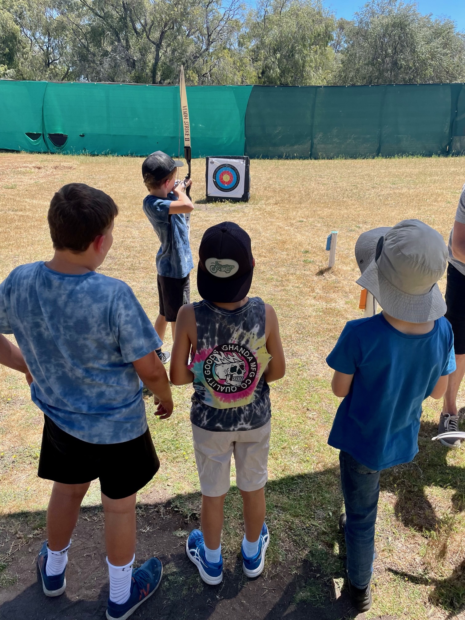 Children taking turns during a beginner-friendly group archery session at Primal Archery in Busselton.