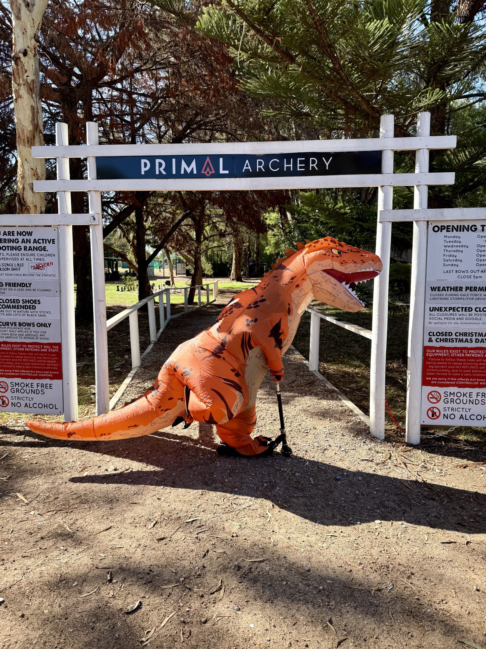 Nugget, the Primal Archery mascot, standing beneath the entrance to Primal Archery in Busselton, Western Australia.