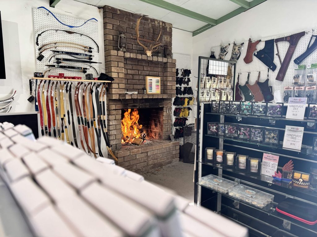 Inside the Primal Archery shop in Busselton, featuring the fireplace and welcoming visitor area.